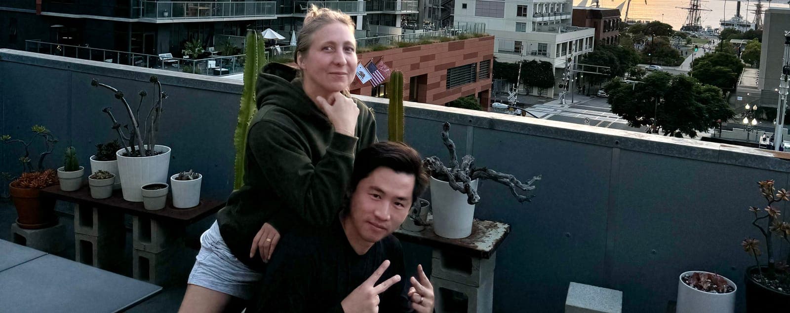 Dori and Eric together on a rooftop at sunset